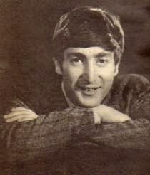 John Lennon with his arms folded