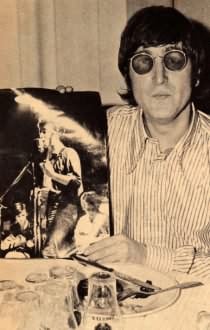 John Lennon and a photo of himself